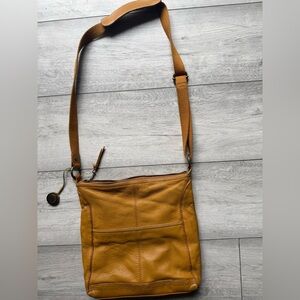 The Sak Leather  Mustard Crossbody Bag Adjustable strap.